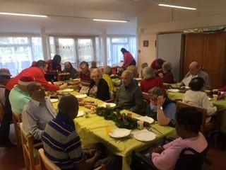 Group having Christmas lunch