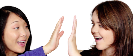 A woman and a young person clapping hands