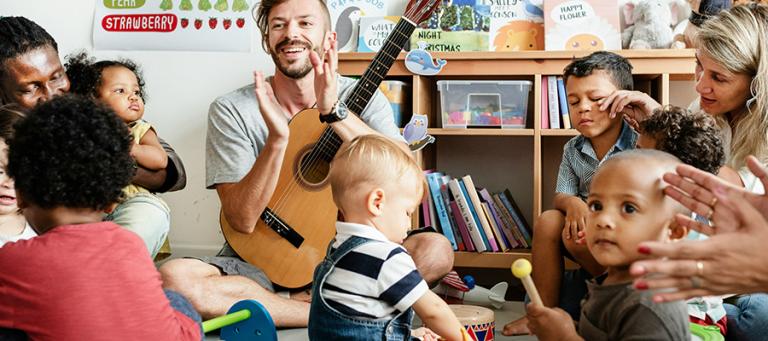 A group of toddlers and parents at a music group