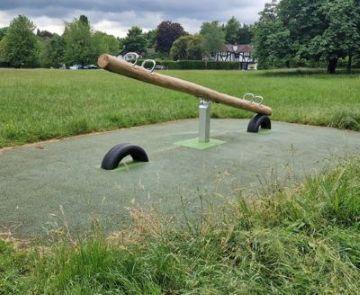 Photograph of the see saw woodcote village