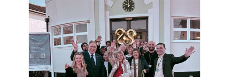 Mayor Perry outside Shirley Library