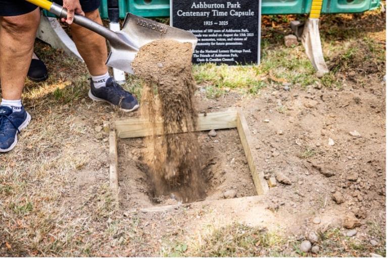 A worker digging a hole