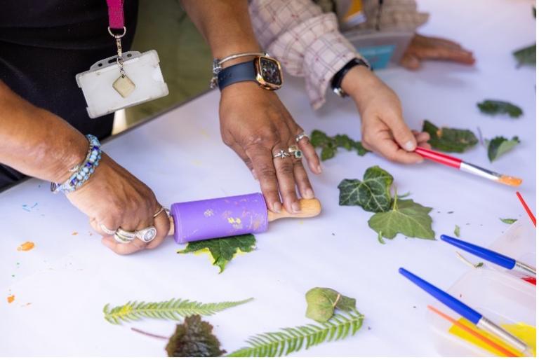 People pressing leaves