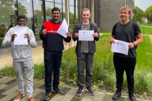 Students from Coombe Wood School with their exam results
