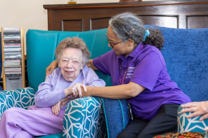 An older person with a care worker
