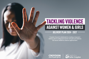 A woman with her head down and hand outstretched saying no, with the text: Tackling violence against women and girls