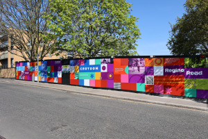 Colourful hoardings at the Regina Road estate