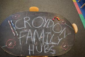 Croydon Family Hubs written on a table in chalk