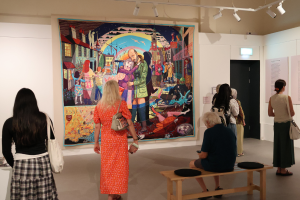 People viewing a Grayson Perry artwork in Museum of Croydon