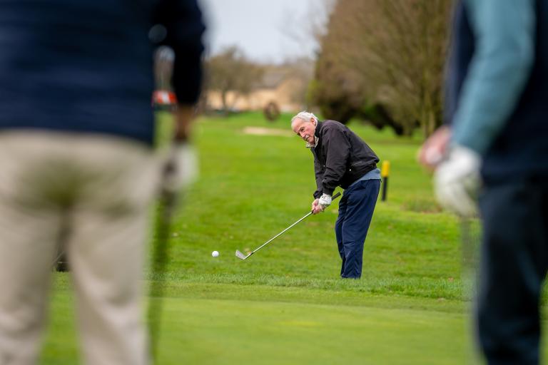 A man playing golf