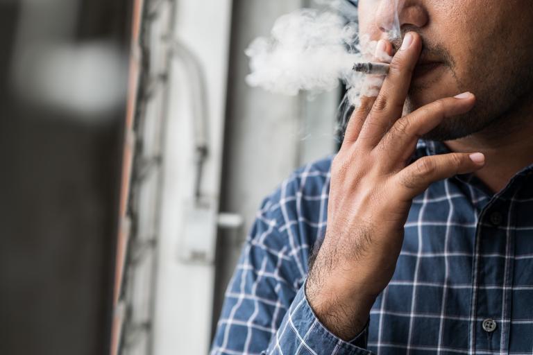 Man smokes a cigarette