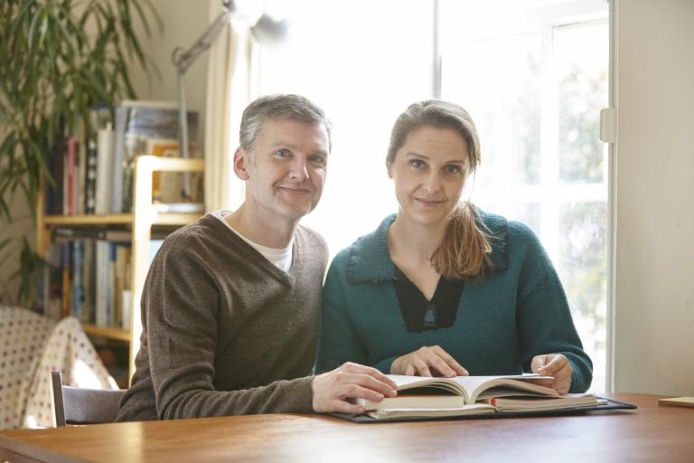 Two foster parents sitting at a table